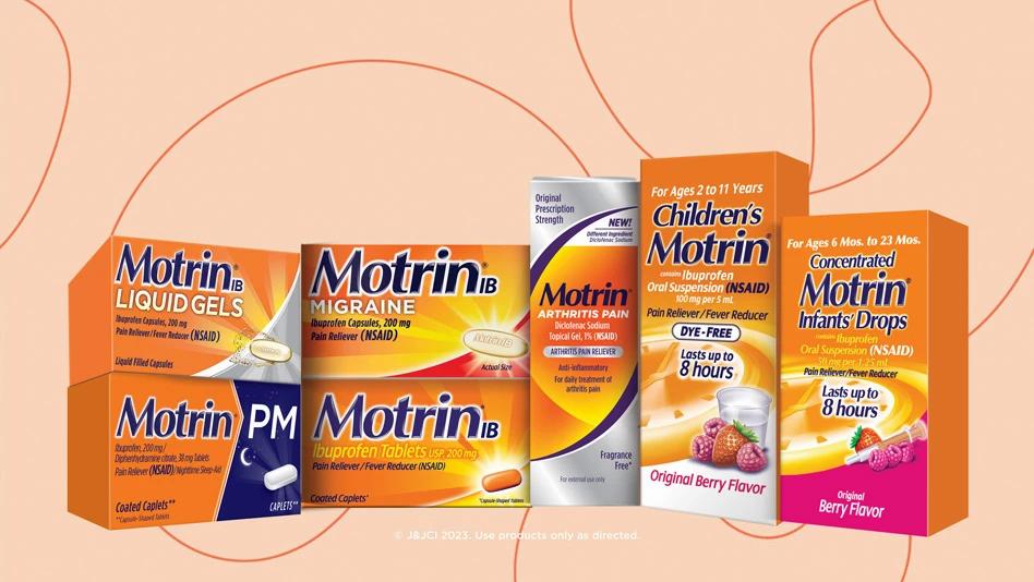 A lineup of Motrin products against a peach-tone background.