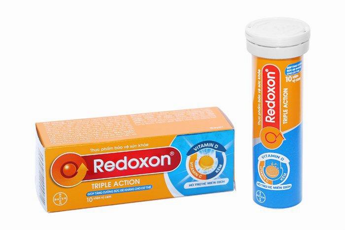 A box and tube of Redoxon Triple Action, a vitamin C supplement.
