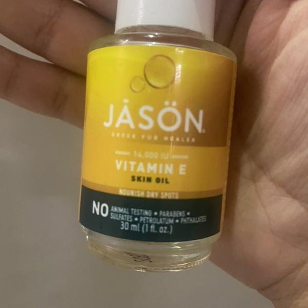 A small bottle of Jason Vitamin E Skin Oil, which is paraben, sulfate, petrolatum, and phthalate free, and not tested on animals.
