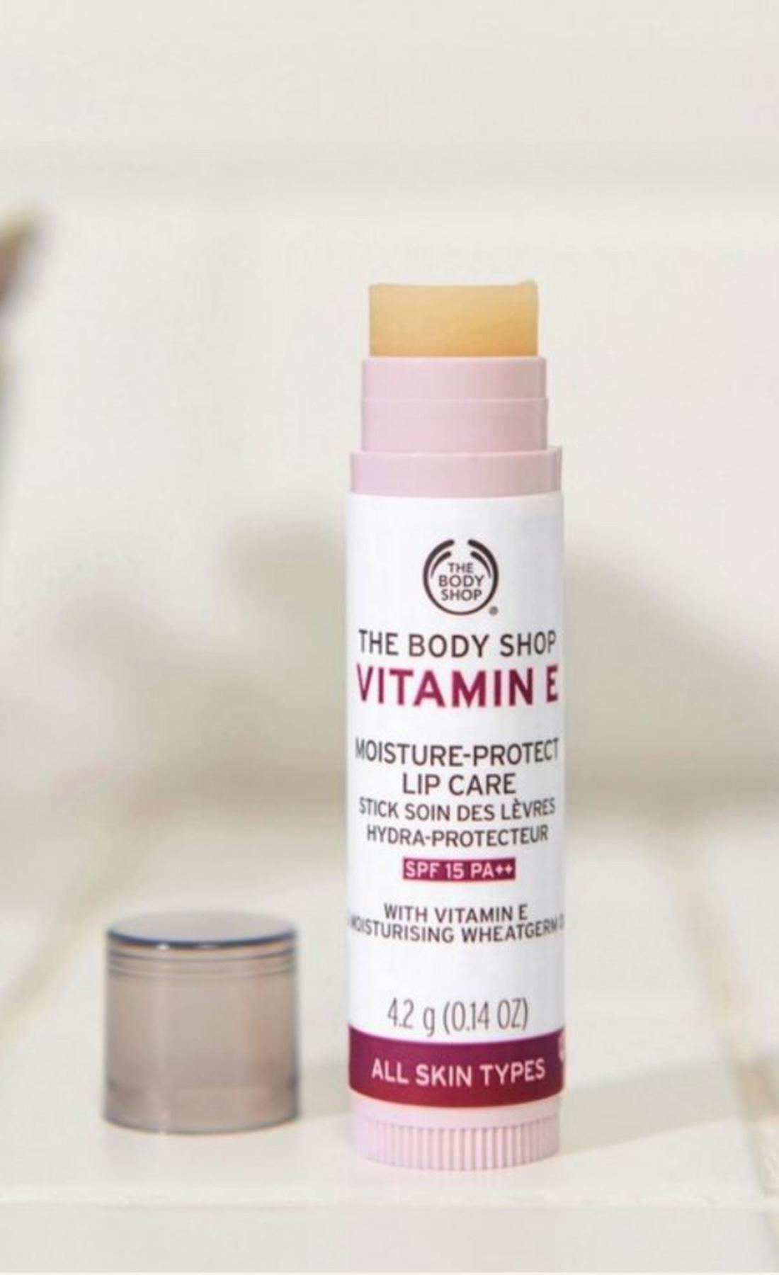 A pink tube of The Body Shops Vitamin E Moisture-Protect Lip Care with SPF 15.