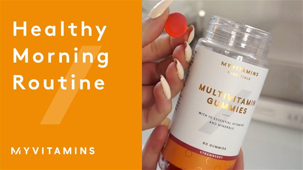 A womans hand holding a bottle of multivitamin gummies with the text My Vitamins and Multivitamin Gummies on the bottle.