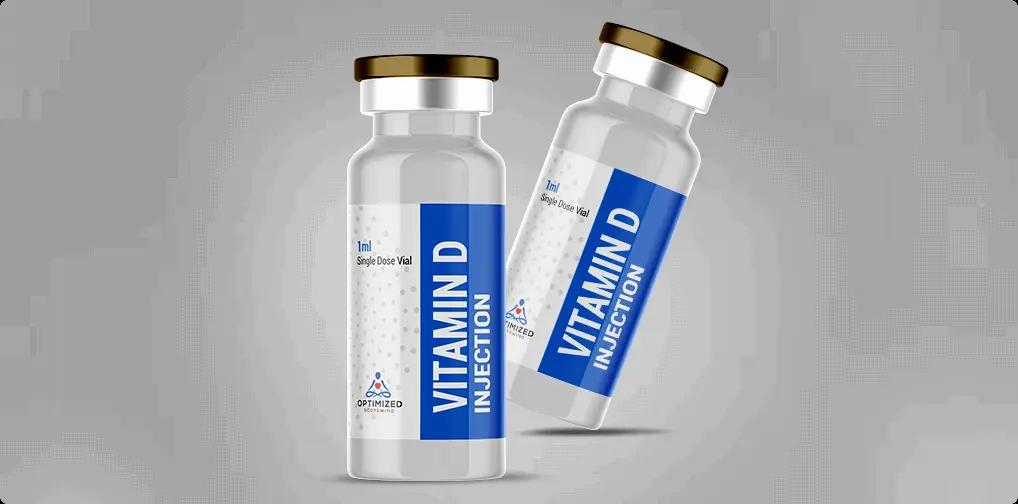 Two blue glass vials of injectable vitamin D.