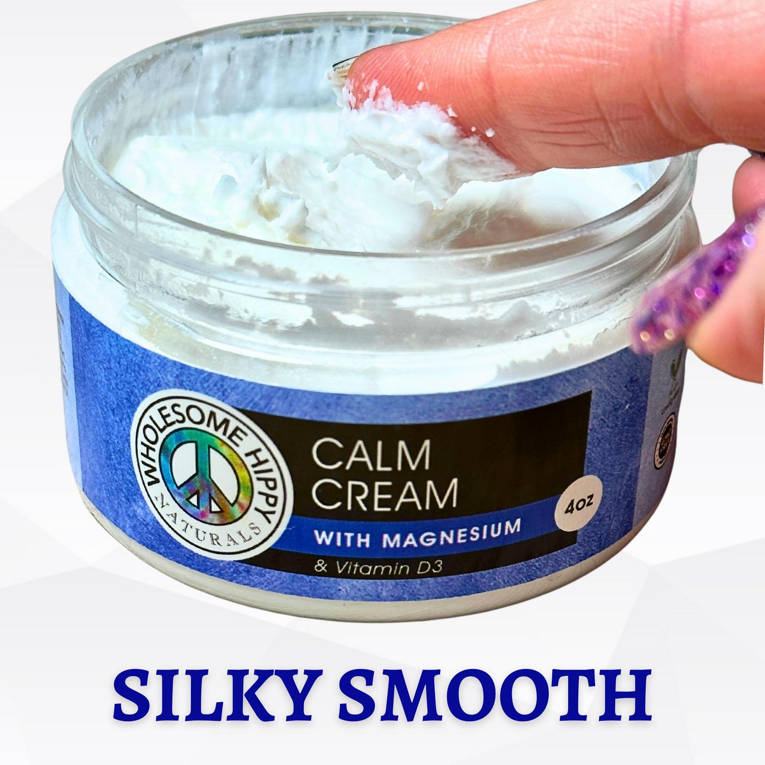 A finger is shown scooping out a silky smooth white cream from a jar labeled Calm Cream with Magnesium and Vitamin D3.