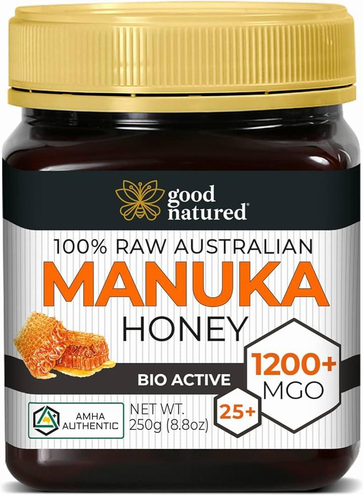 A jar of Good Natured 100% Raw Australian Manuka Honey with a gold lid, black label with yellow and white text, and an image of a honeycomb and a bee on the front.