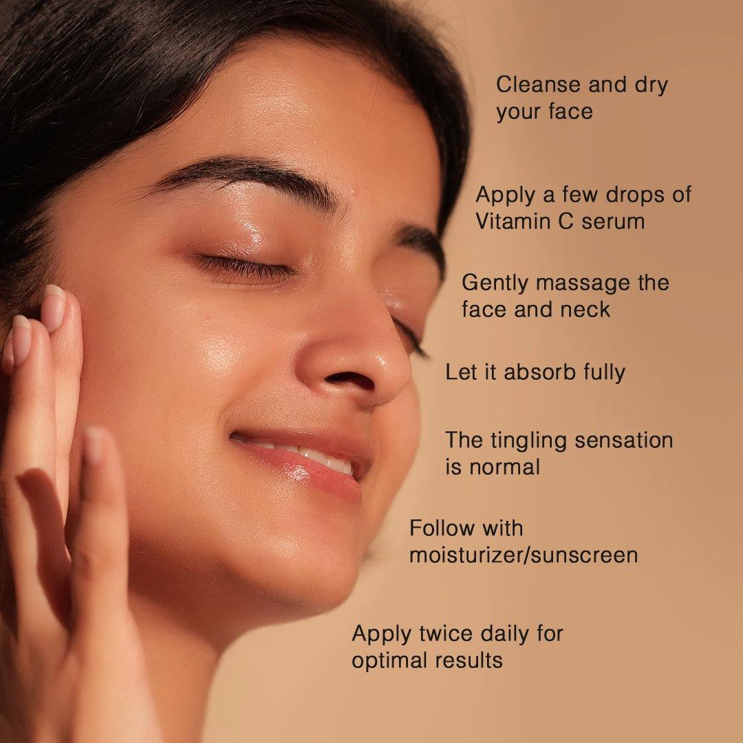 A woman with her eyes closed is applying a serum to her face with text overlay of instructions for applying the product.