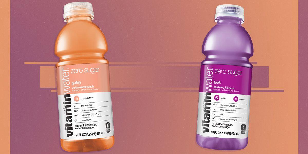 Two bottles of Vitamin Water Zero Sugar, one in the flavor watermelon peach and the other blueberry hibiscus.