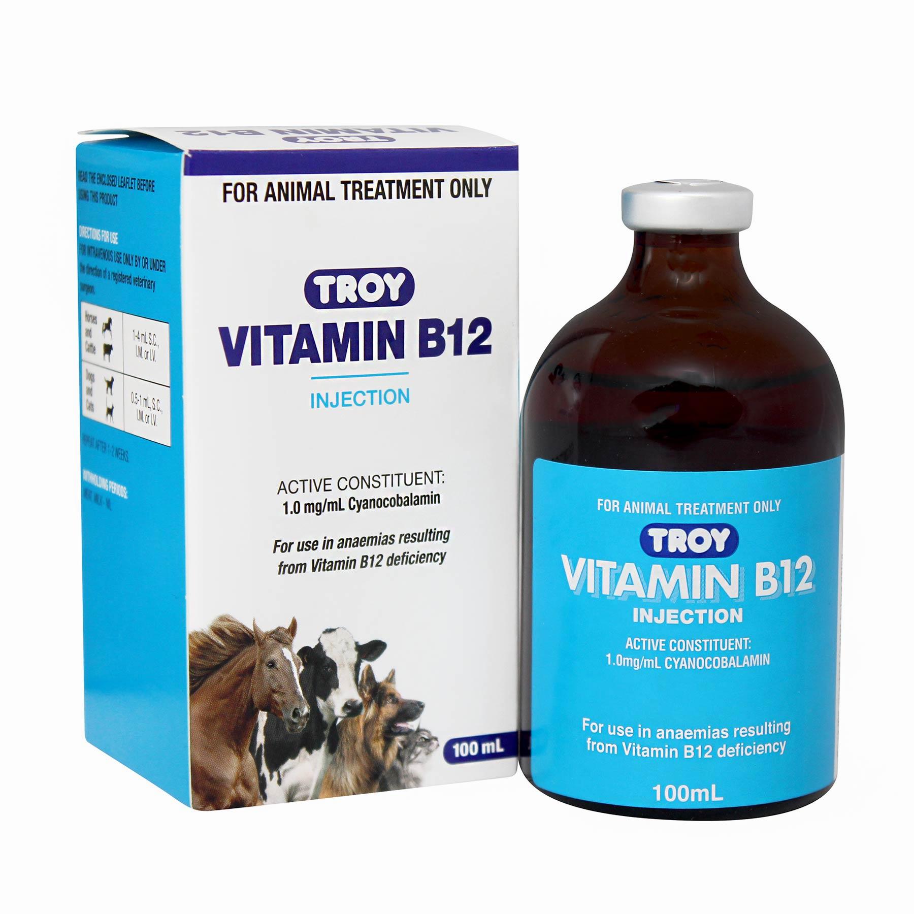 A brown glass vial of Troy Vitamin B12 injection, a treatment for anemia in animals, next to its packaging.