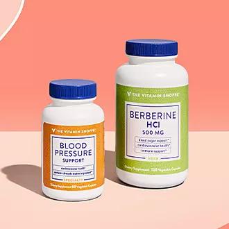 Two bottles of supplements, one labeled Blood Pressure Support and the other labeled Berberine HCI.