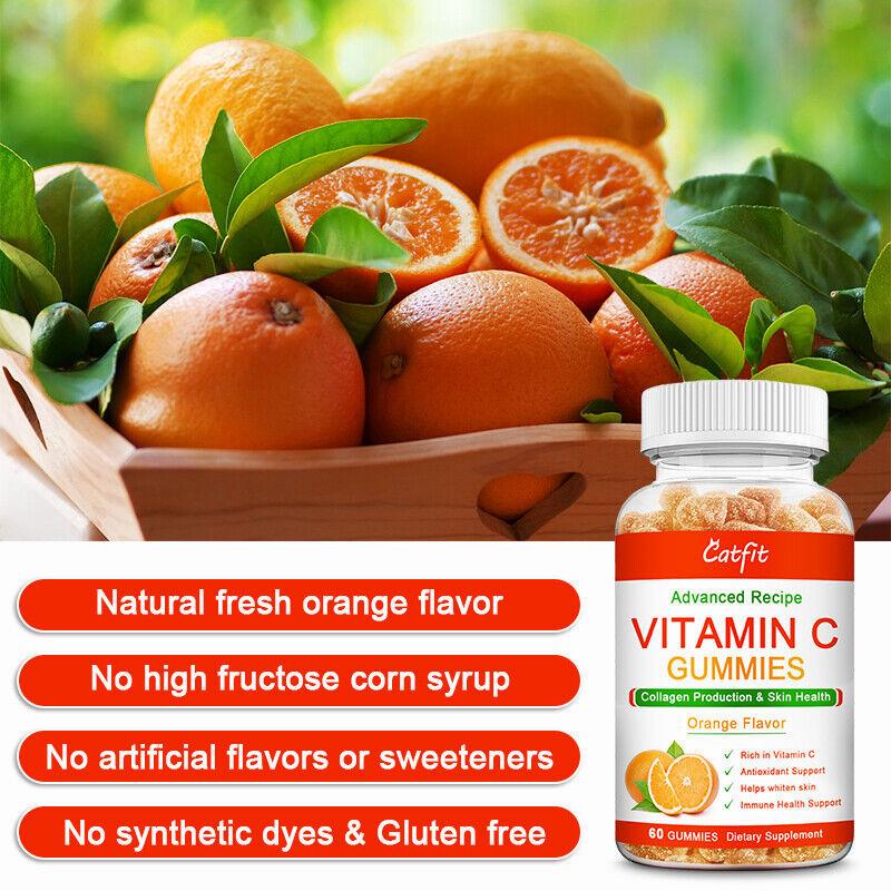 A bottle of orange-flavored vitamin C gummies next to a pile of fresh oranges.