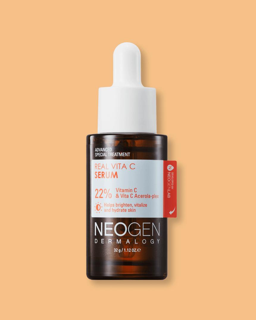 A brown bottle of Neogen Real Vita C Serum with a white dropper cap.
