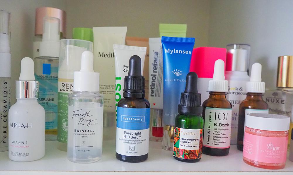 A variety of skincare products on a shelf.