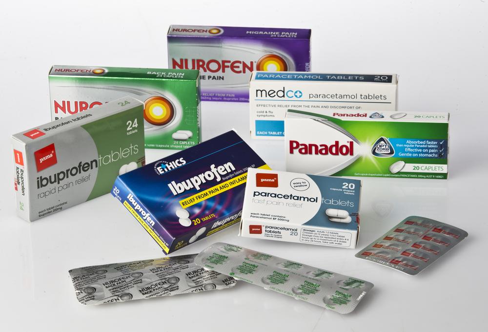 A variety of over-the-counter pain relief medications in blister packs.
