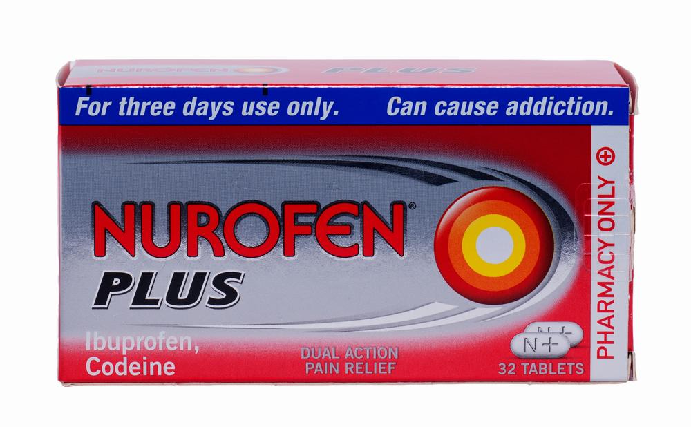 A red and white box of Nurofen Plus tablets, a pharmacy-only medication for pain relief.