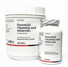 A large bottle and a small bottle of essential vitamins and minerals for dogs and cats.