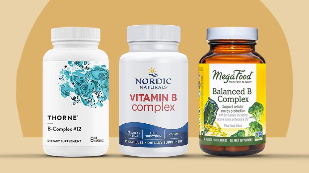 Three bottles of different brands of B-complex vitamins.