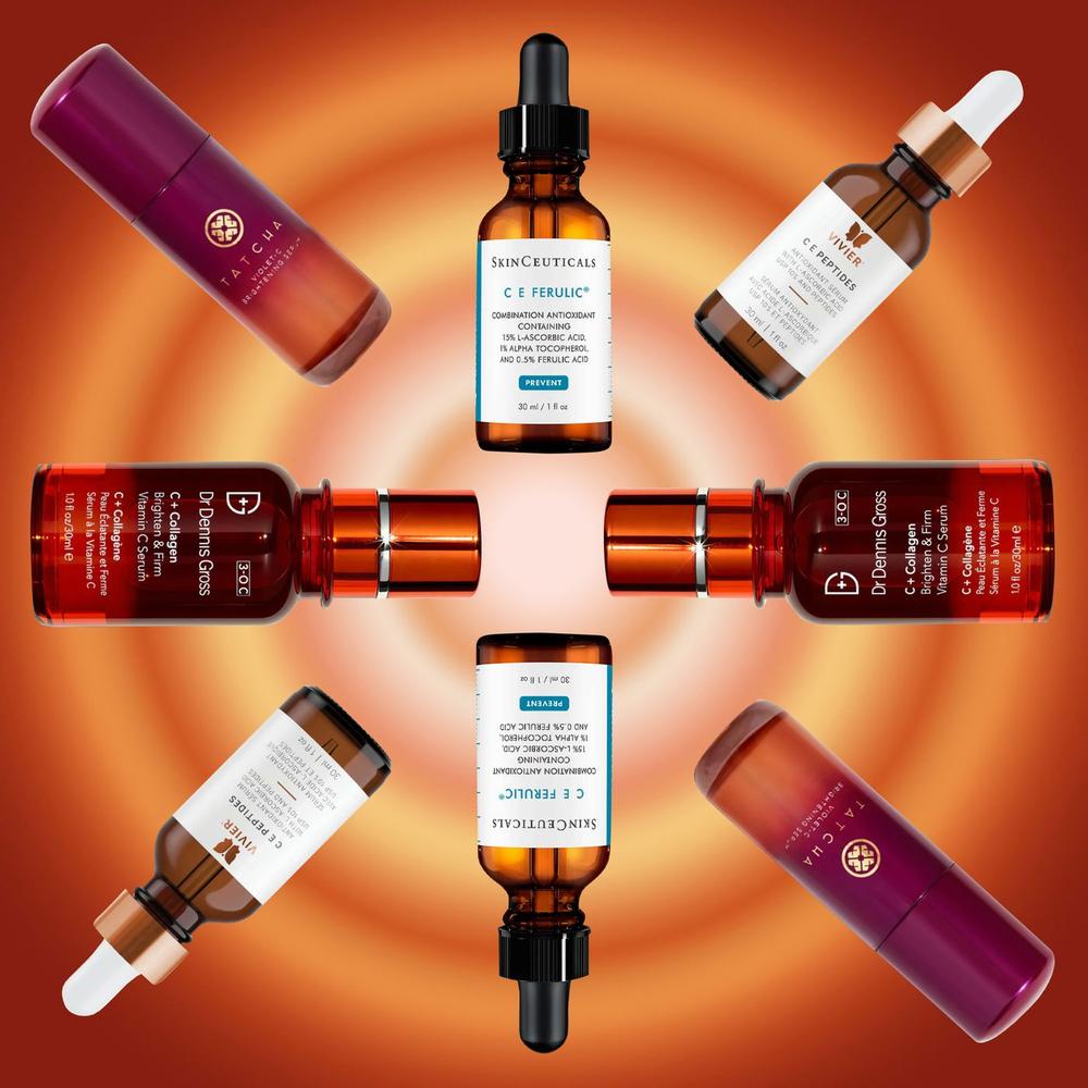 A collection of bottles of serums and moisturizers with orange-colored backgrounds.