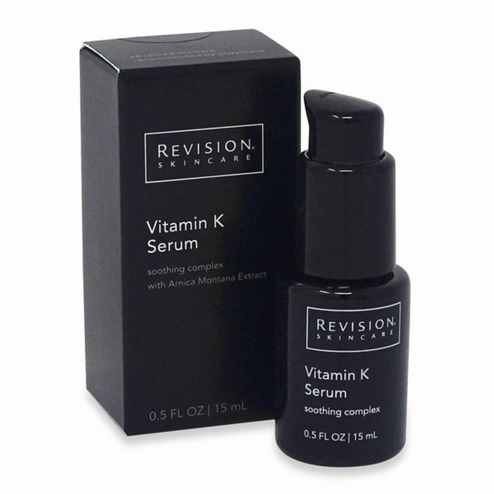 A black Revision Skincare box with a black pump-top bottle of Vitamin K serum in front of it.