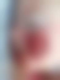 This image shows a blurred close-up of a womans face.