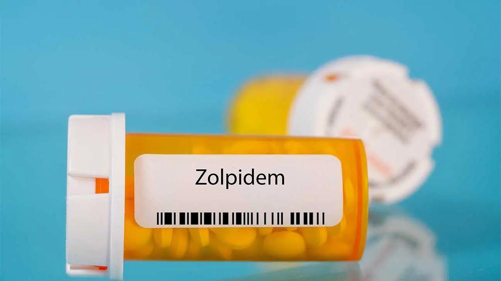 A close-up of a prescription bottle labeled zolpidem.