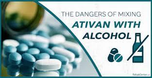 A close-up of a bottle of pills next to a glass of alcohol with the text The Dangers of Mixing Ativan with Alcohol.