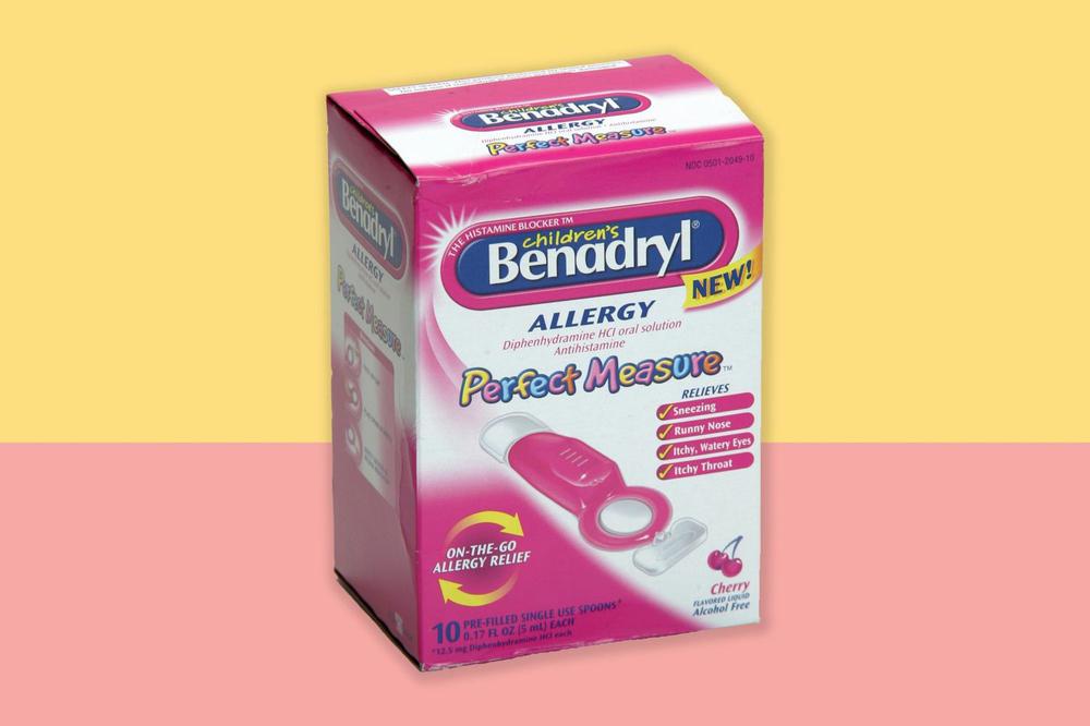 A box of childrens Benadryl allergy medicine, which comes with a measuring syringe.