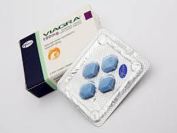A blue pill in a silver blister pack with a blue box labeled Viagra.