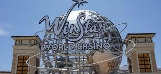 The image shows a large, spherical metal structure with the words WinStar World Casino written on it.