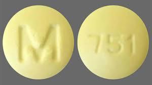 A yellow round pill with the letter M debossed on one side and 751 on the other.