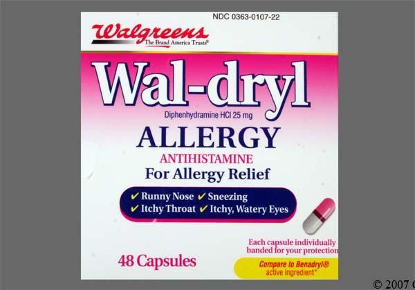 A pink box of allergy relief capsules with a label that includes the product name, active ingredient, and a list of symptoms it treats.