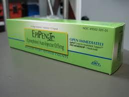 A green and white box of EpiPen Jr, a prescription medication used to treat anaphylaxis.