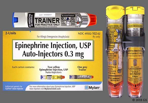 A package of two yellow epinephrine auto-injectors and one grey trainer.