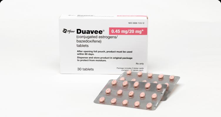 A box of Duavee, a medication used to treat symptoms of menopause, with two blister packs of pills.