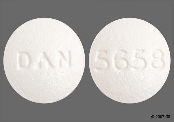A white round pill with the imprint DAN on one side and 5658 on the other.