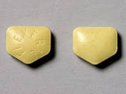 Two yellow pills, each shield-shaped and imprinted with Z47 on one side and RX on the other.