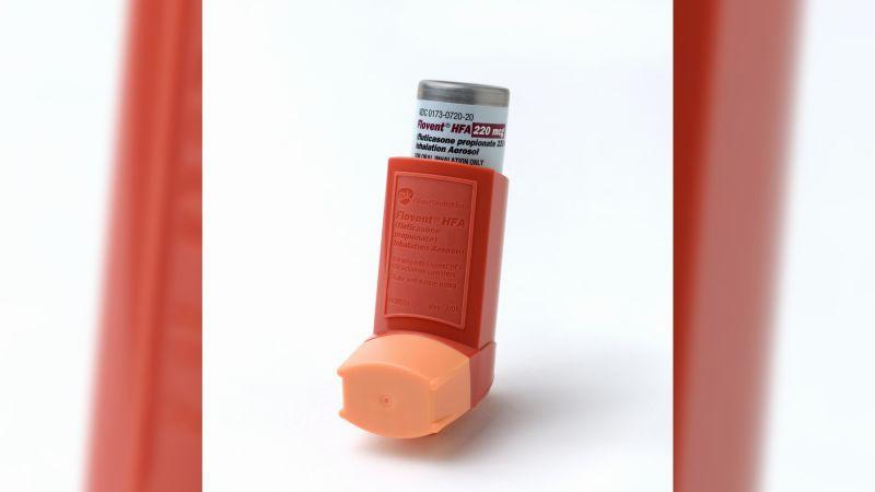 An orange inhaler for asthma.