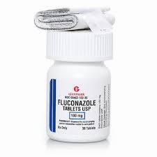A white bottle of antifungal medication, Fluconazole, with a black cap and a white label with blue writing.
