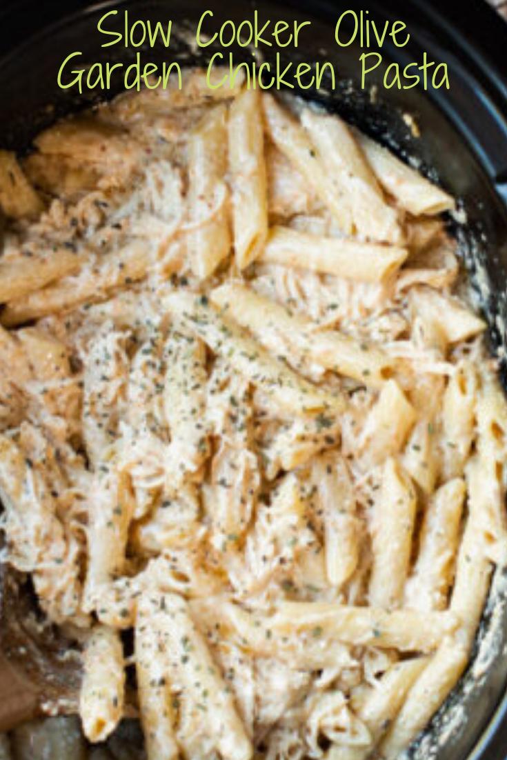 A slow cooker full of creamy chicken pasta.