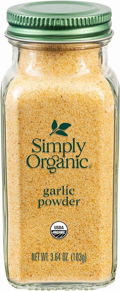 A glass jar of Simply Organic Powder with a green lid.