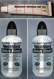 Two bottles of NeilMed Sinus Rinse and a tube of Mupirocin Ointment.